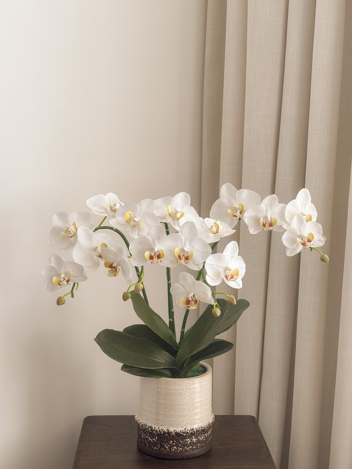 Artificial white orchid arrangement with four arching stems by FAUX Dubai