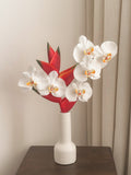 Faux white phalaenopsis orchid and red heliconia arrangement by FAUX Dubai