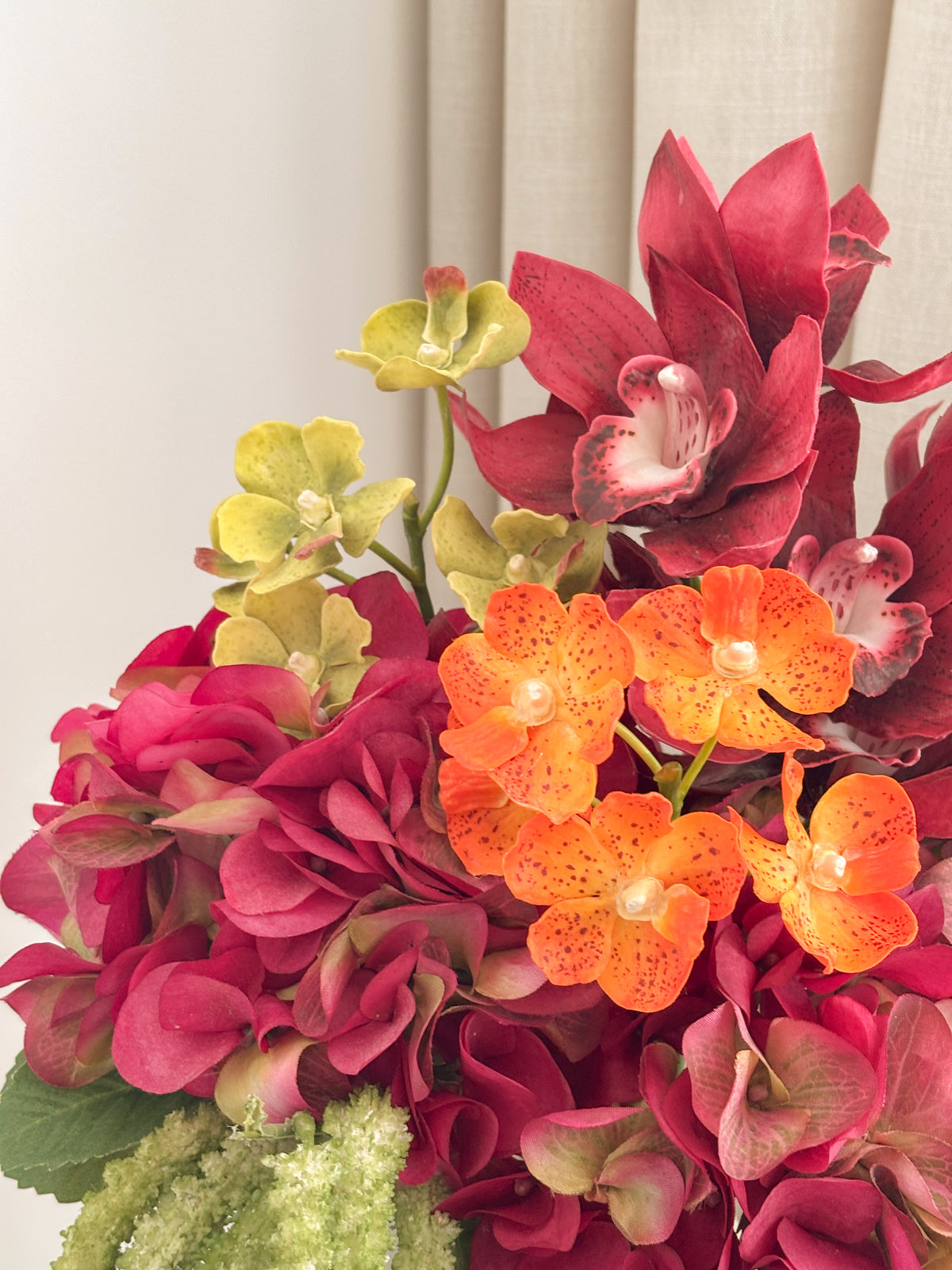 Detail view: faux cymbidium orchid and hydrangea arrangement by FAUX Dubai