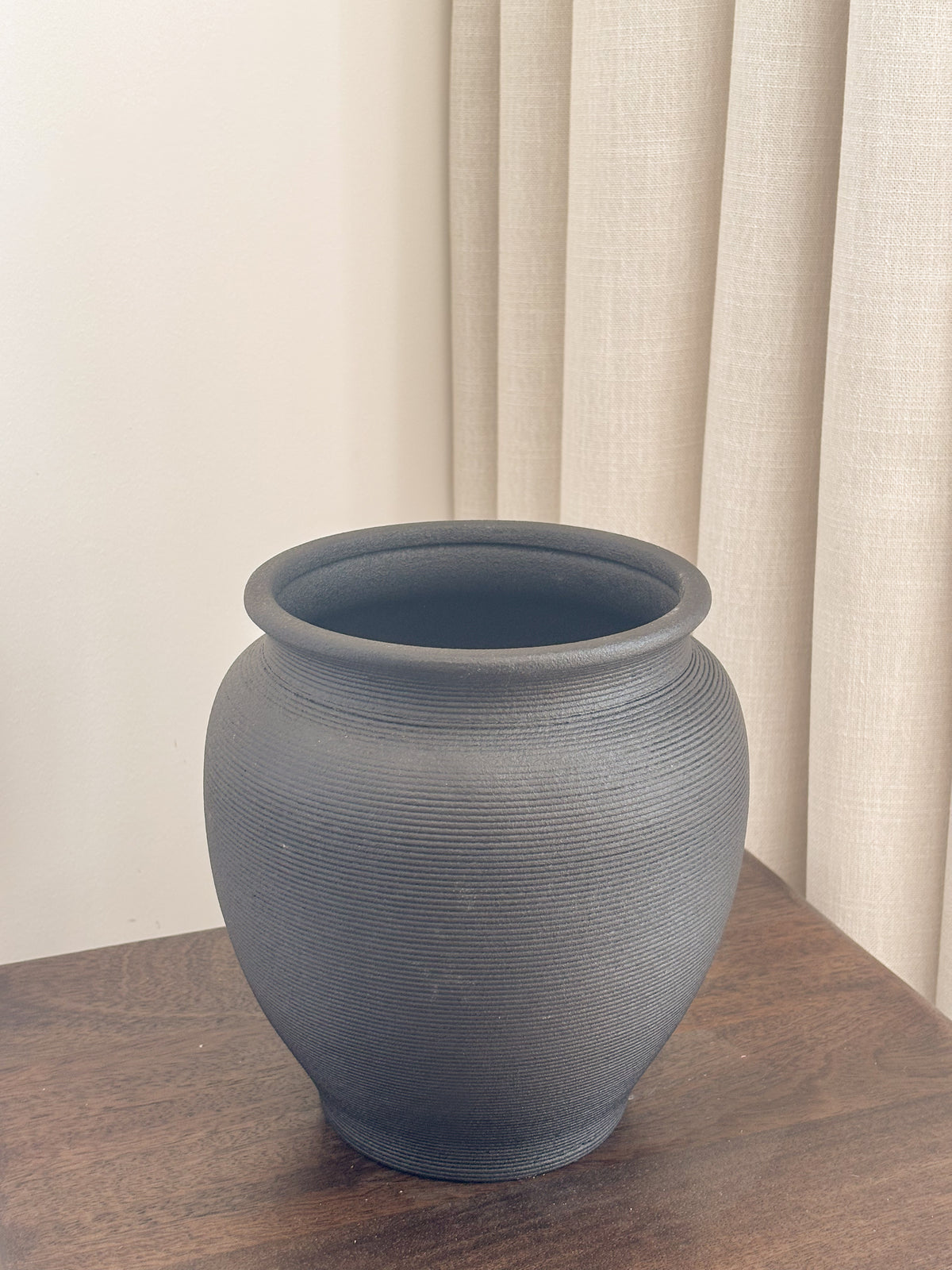 Black ribbed ceramic urn vase, Vase Onyx by FAUX Dubai