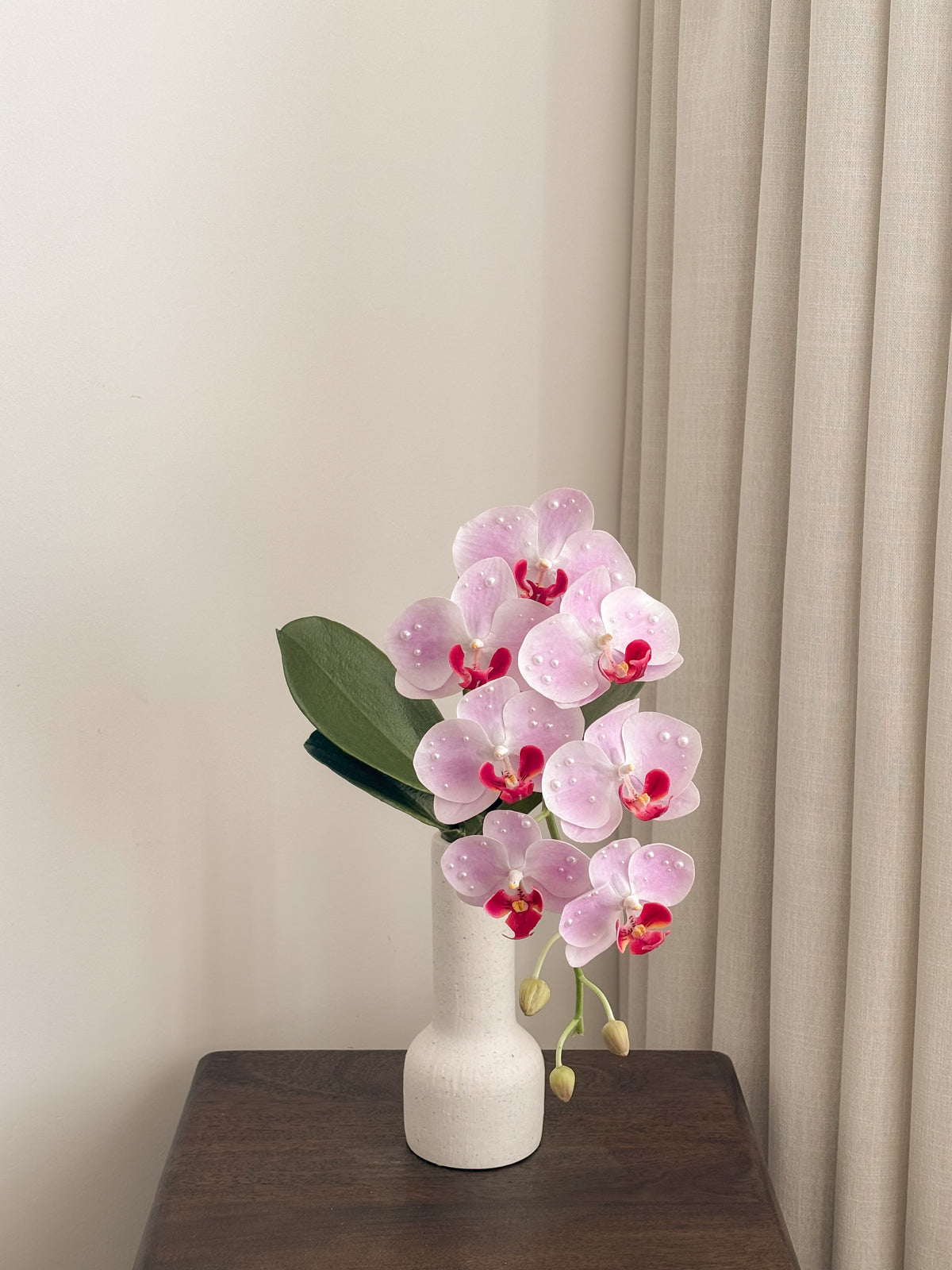 Blush pink faux orchid stem embellished with pearls by FAUX Dubai
