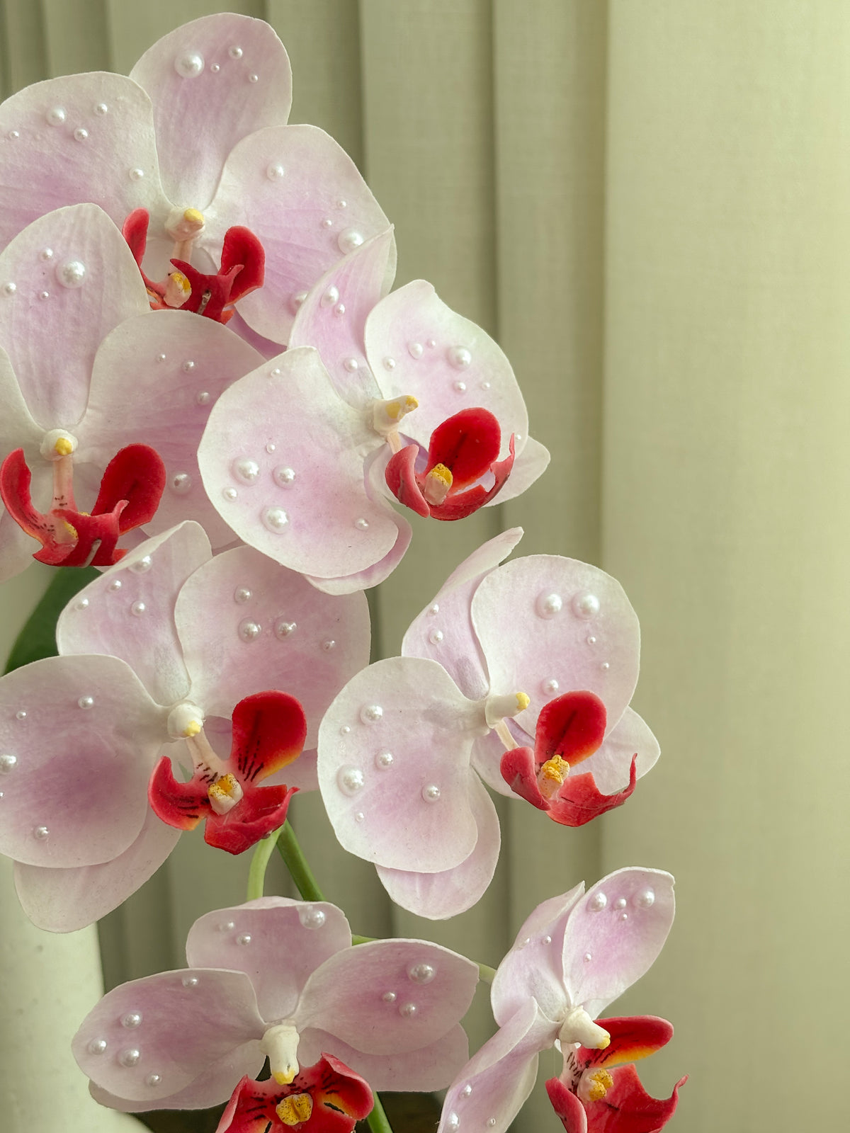 Detail view: blush pink faux orchid with pearls by FAUX Dubai
